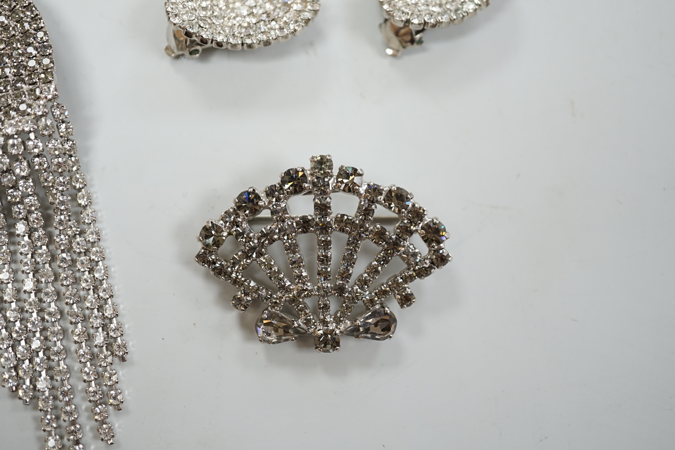Two pairs of Monty Dom paste set earrings including bird's head with tassel drops, 10.2cm and a similar Monty Dom bracelet and brooch